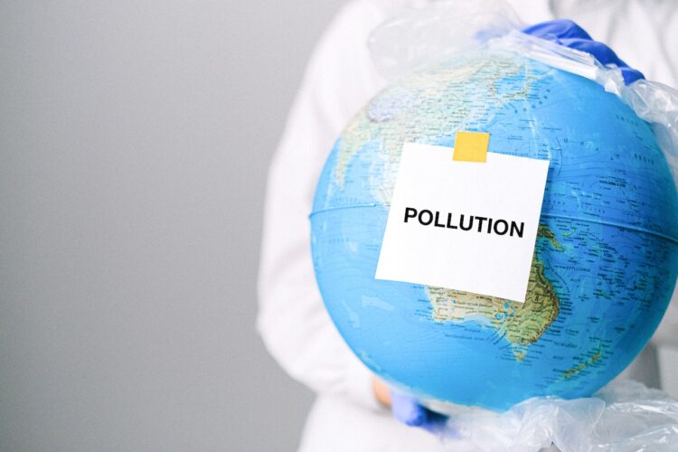 globe with pollution text